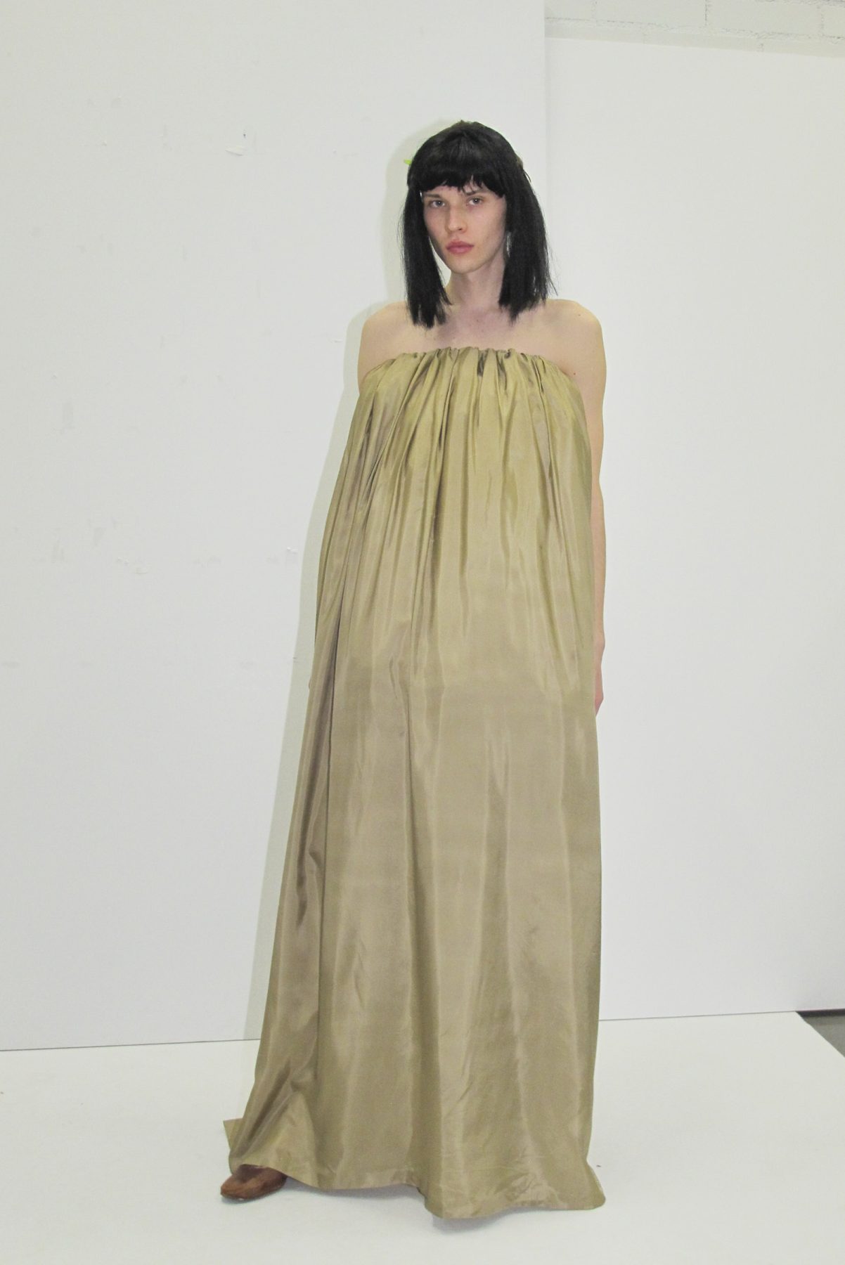 Photo of model wearing light brown long voluminous dress