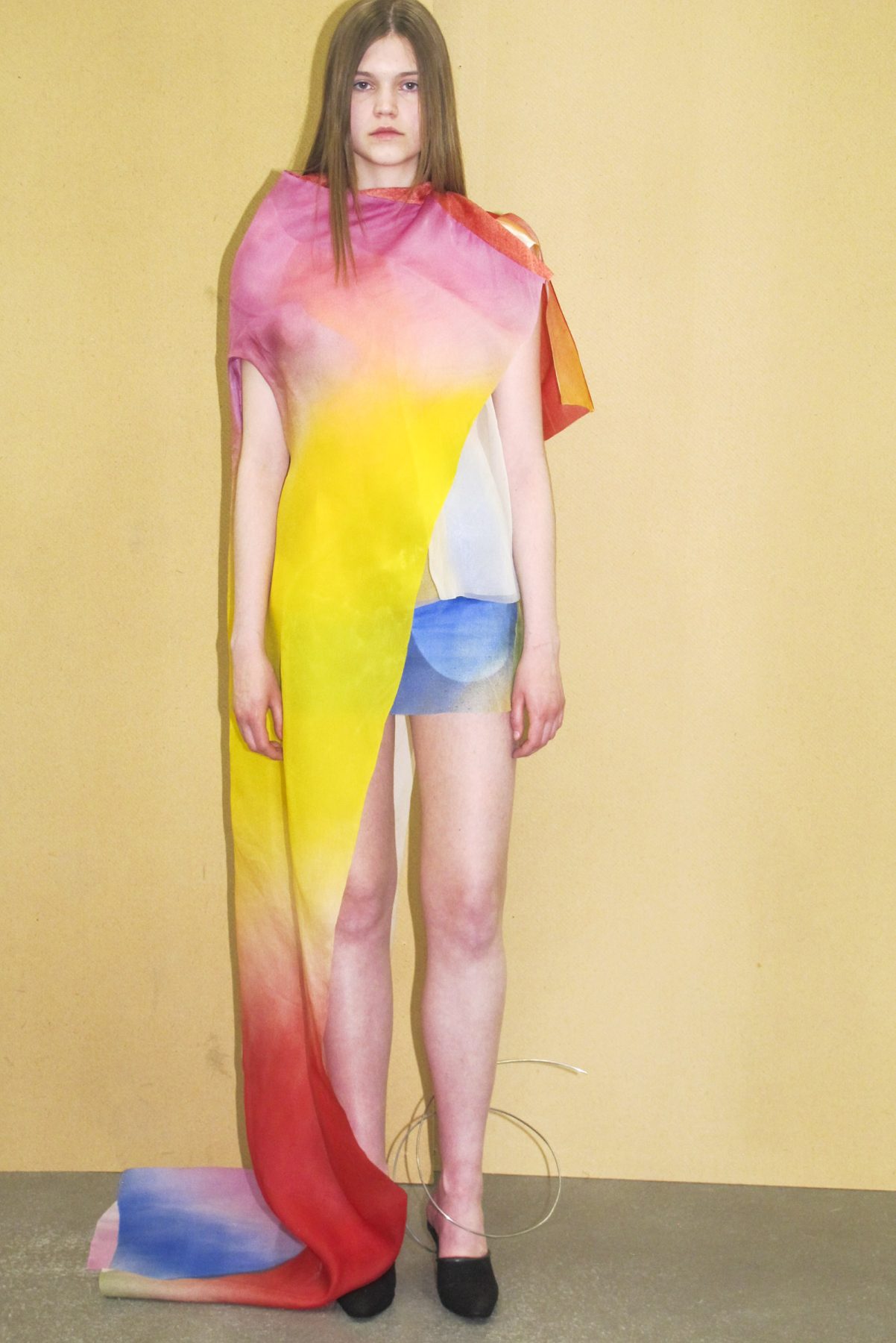 Photo of model wearing colorful swirl dress