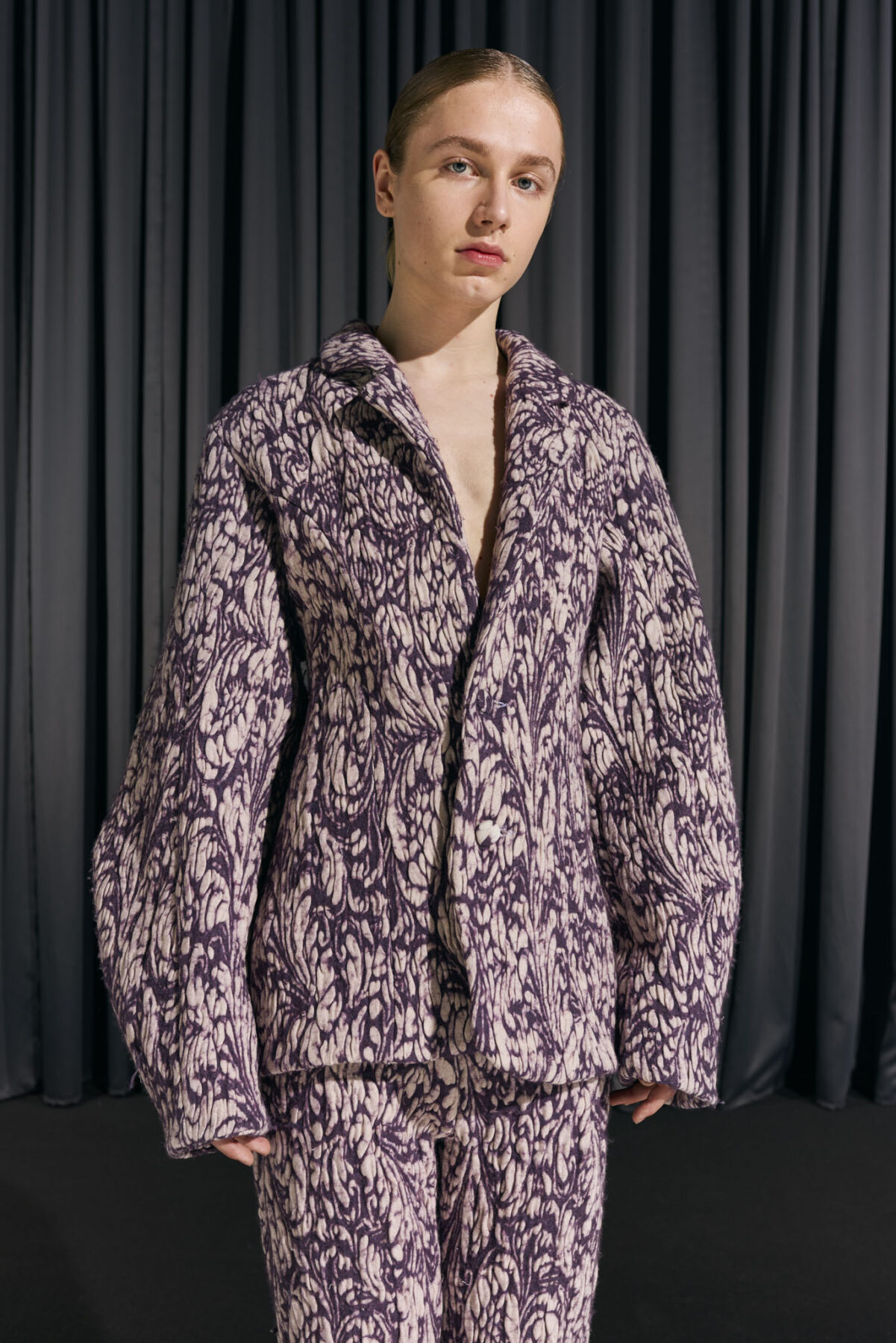 Model wearing Aalto University graduate collection