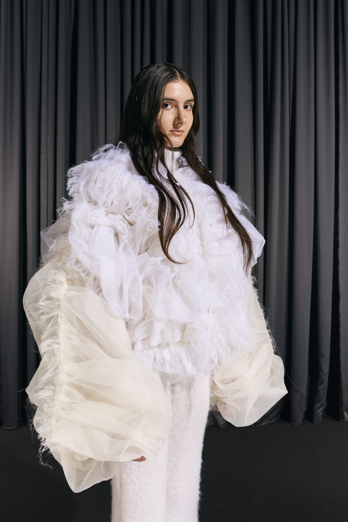 Model wearing Aalto University graduate collection