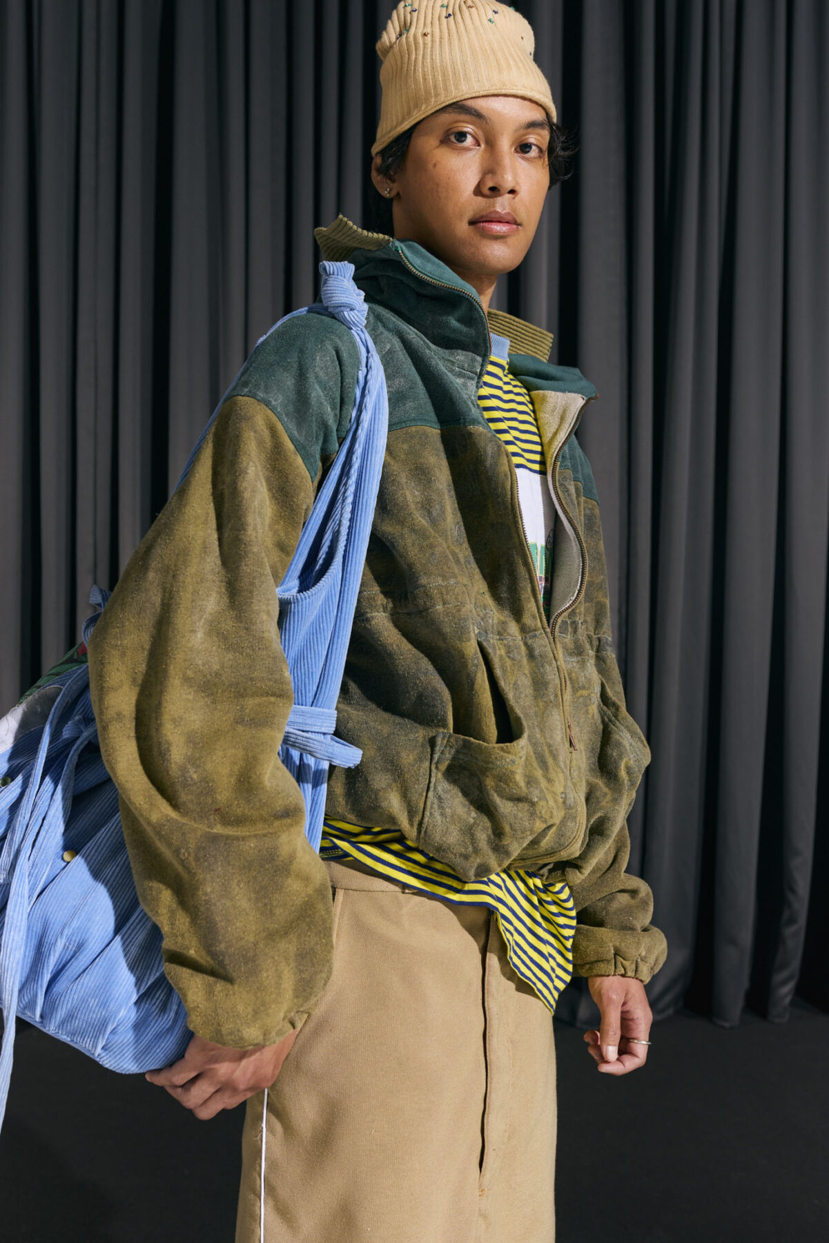 Model wearing Aalto University graduate collection