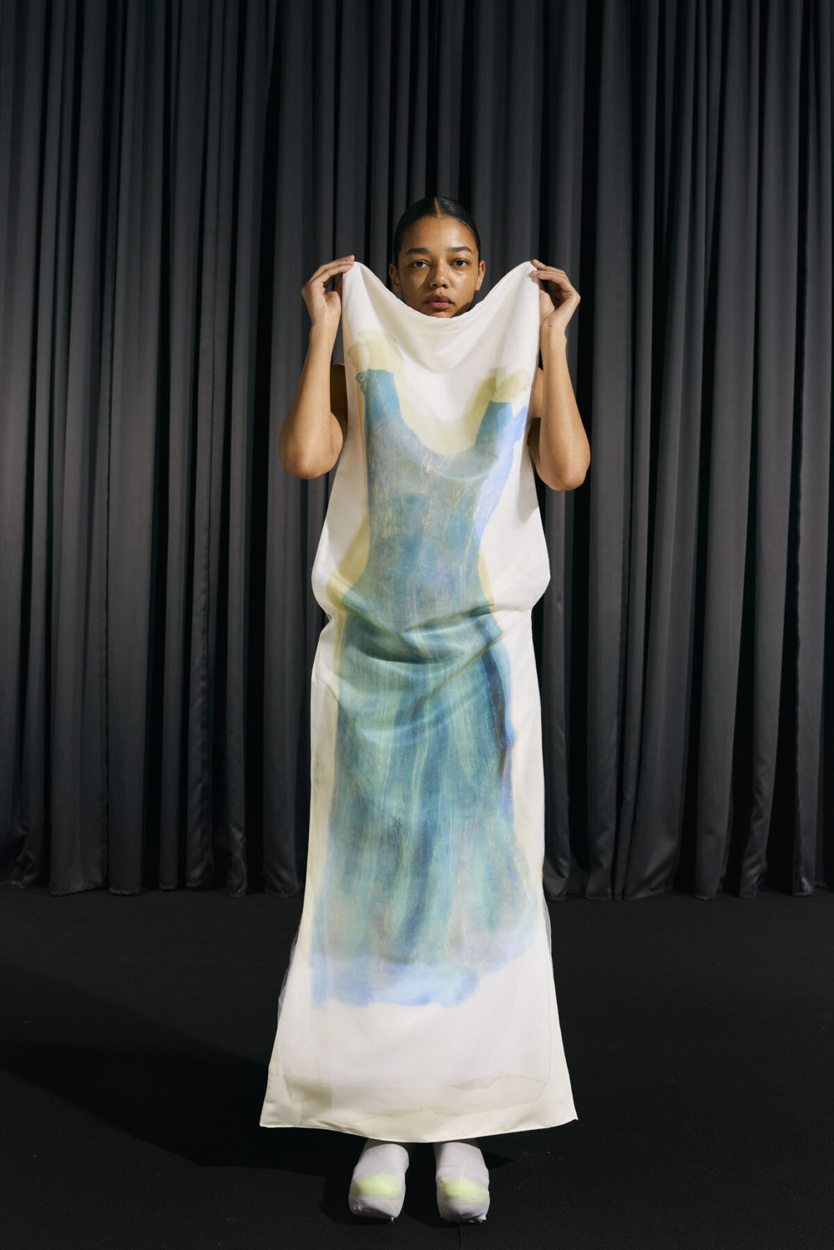 Model wearing Aalto University graduate collection
