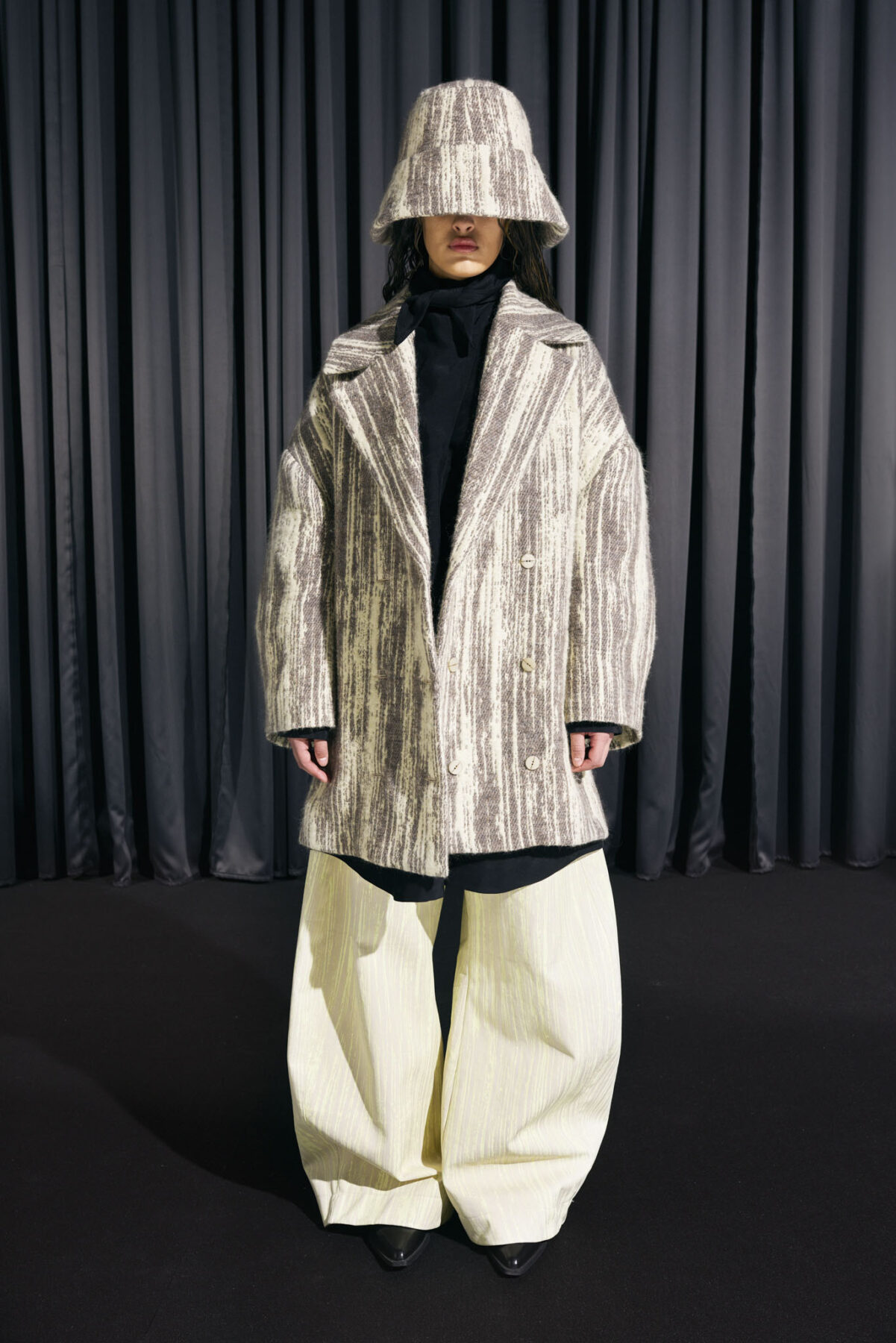 Model wearing Aalto University graduate collection